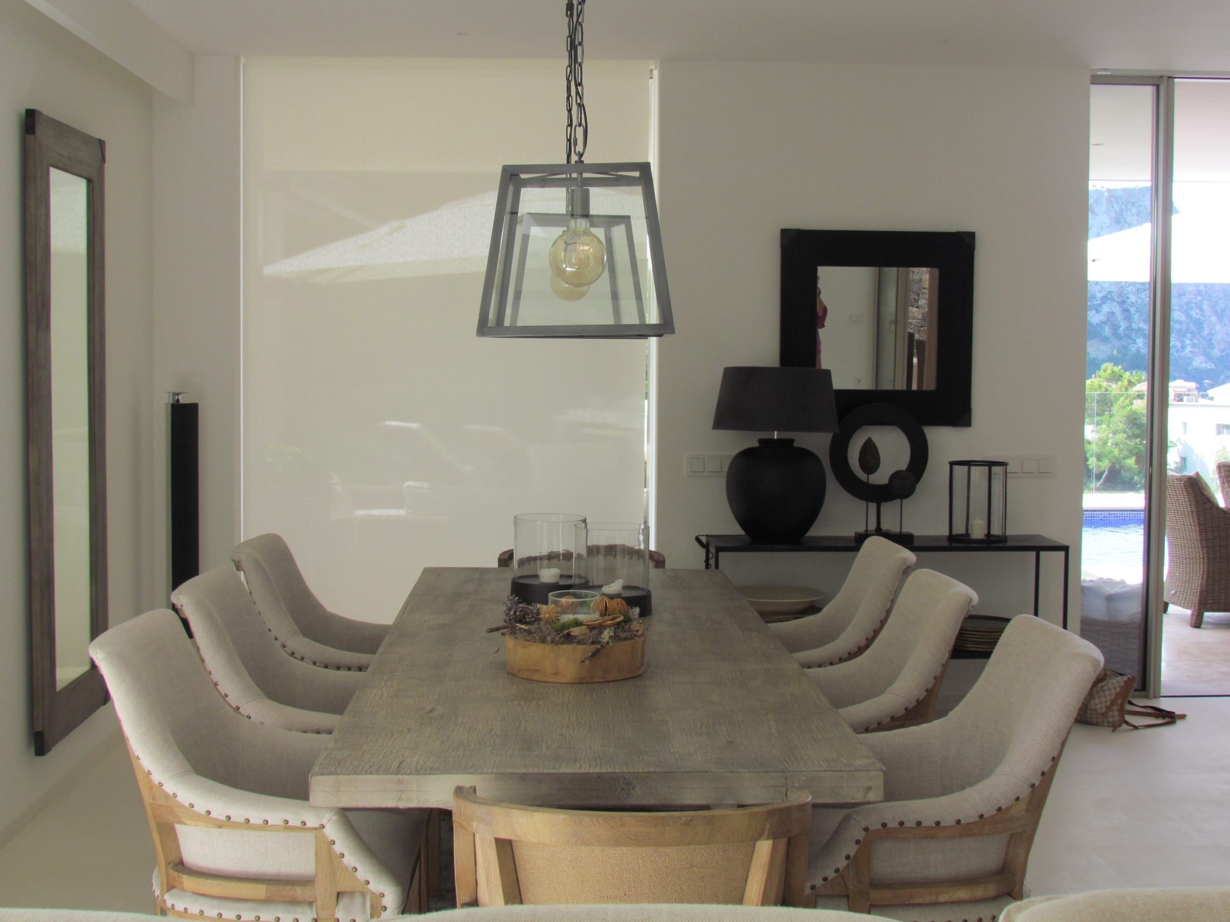Dining area with a translucent roller blind behind the table