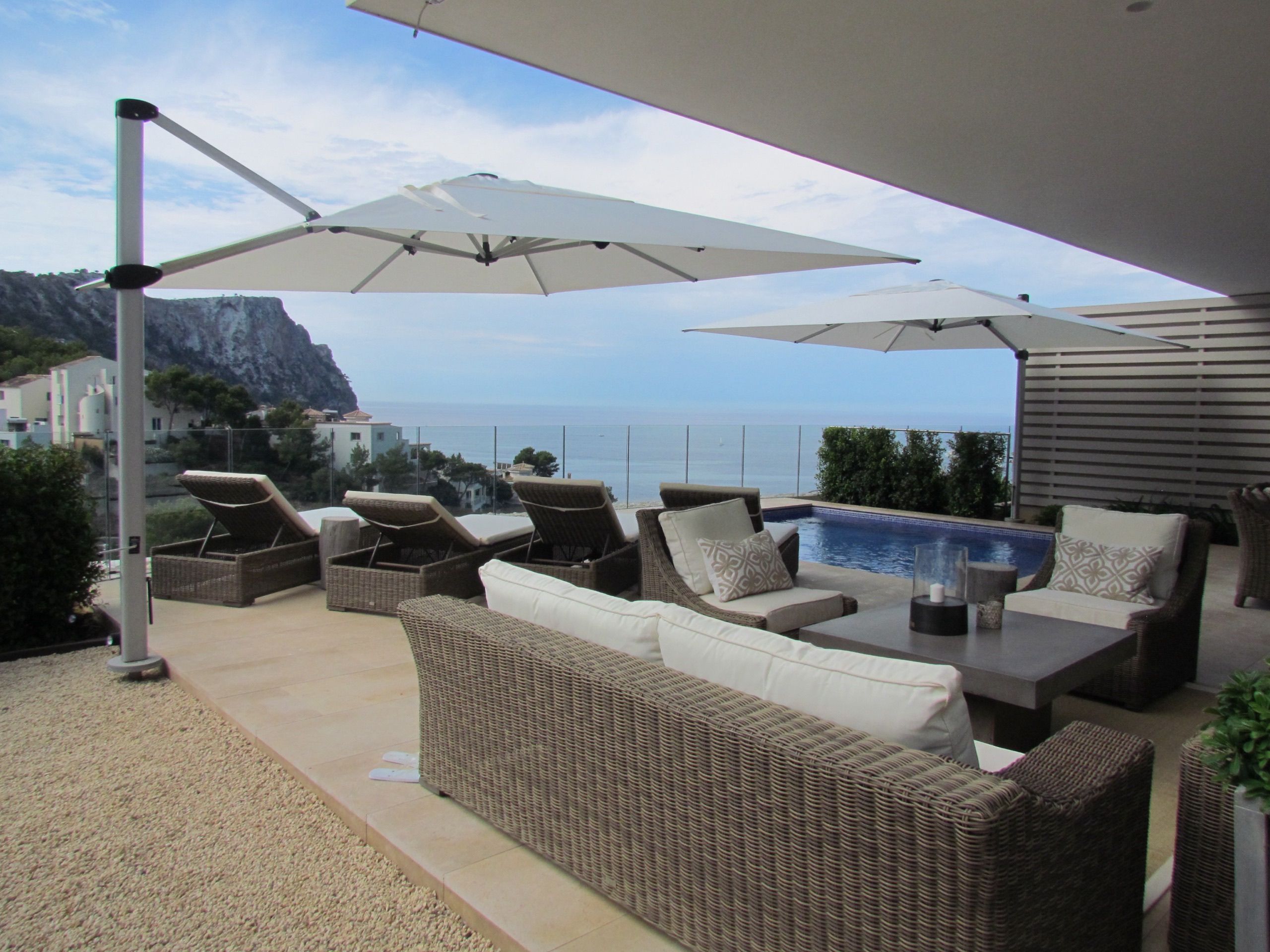 Parasol open over an outdoor seating area in Puerto de Andratx, Mallorca