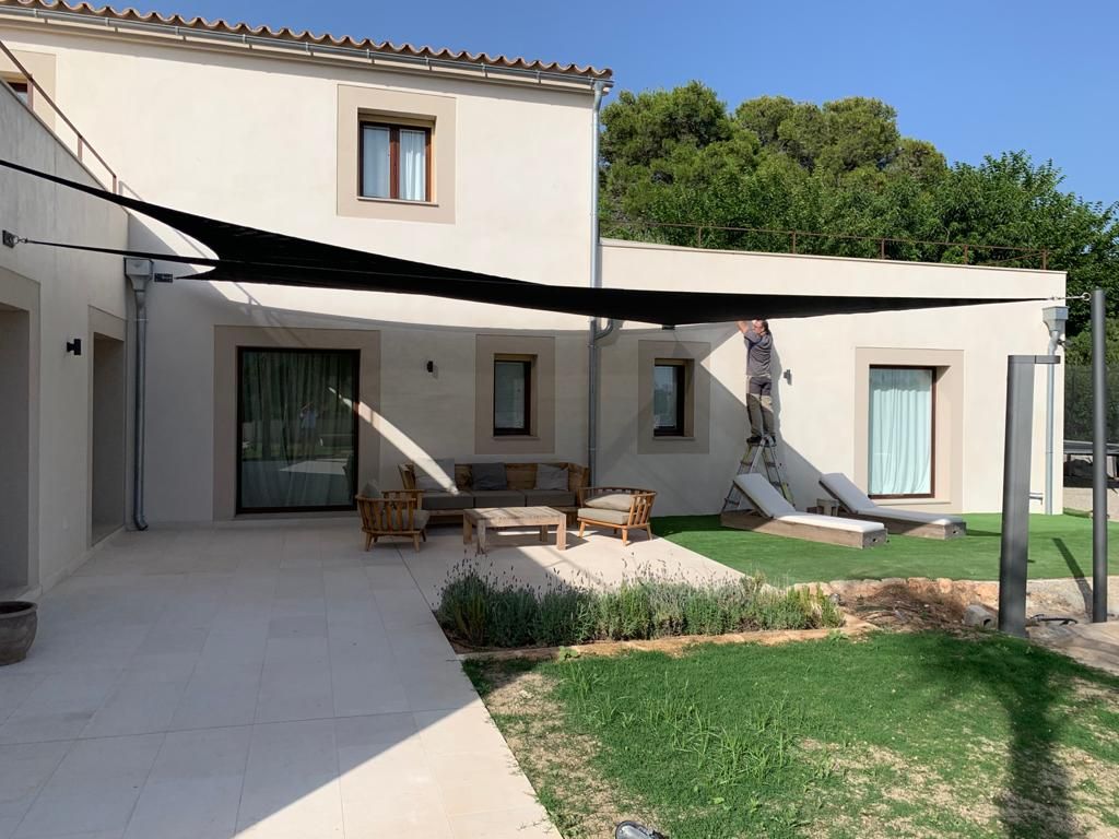 Shade sails covering the terrace and solarium area in Santa Maria de Camí, Mallorca