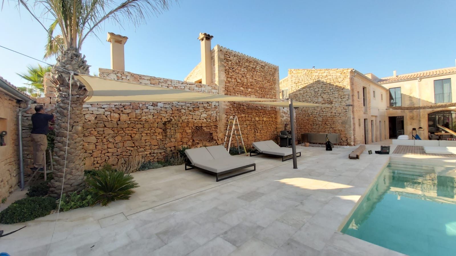 Two shade sails over a sunbathing area in Santanyí, Mallorca