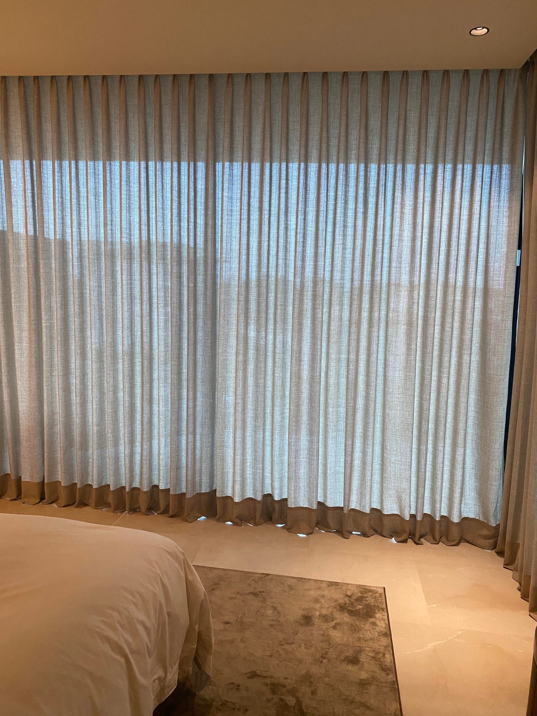 Bedroom with double pinch pleat curtains