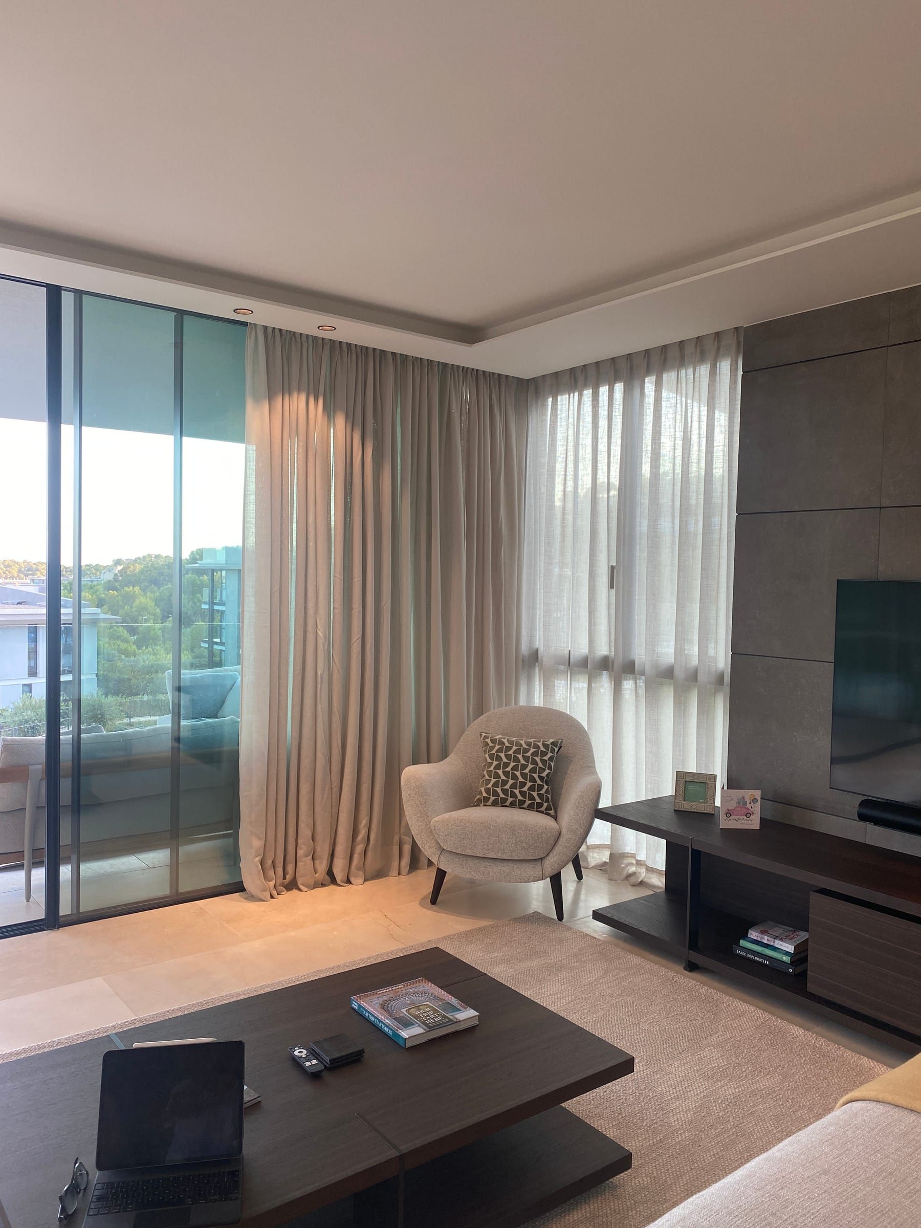 Living room with hand-sewn double pinch pleat curtains