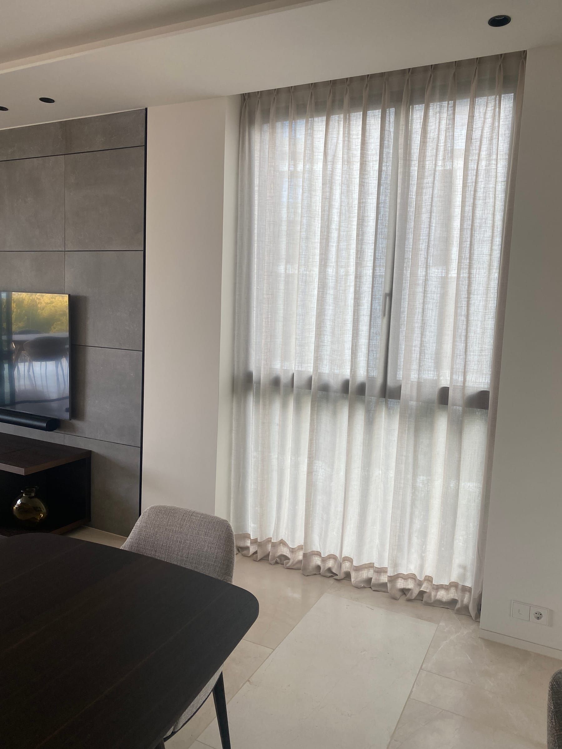 Double pinch pleat sheer at a living-room window