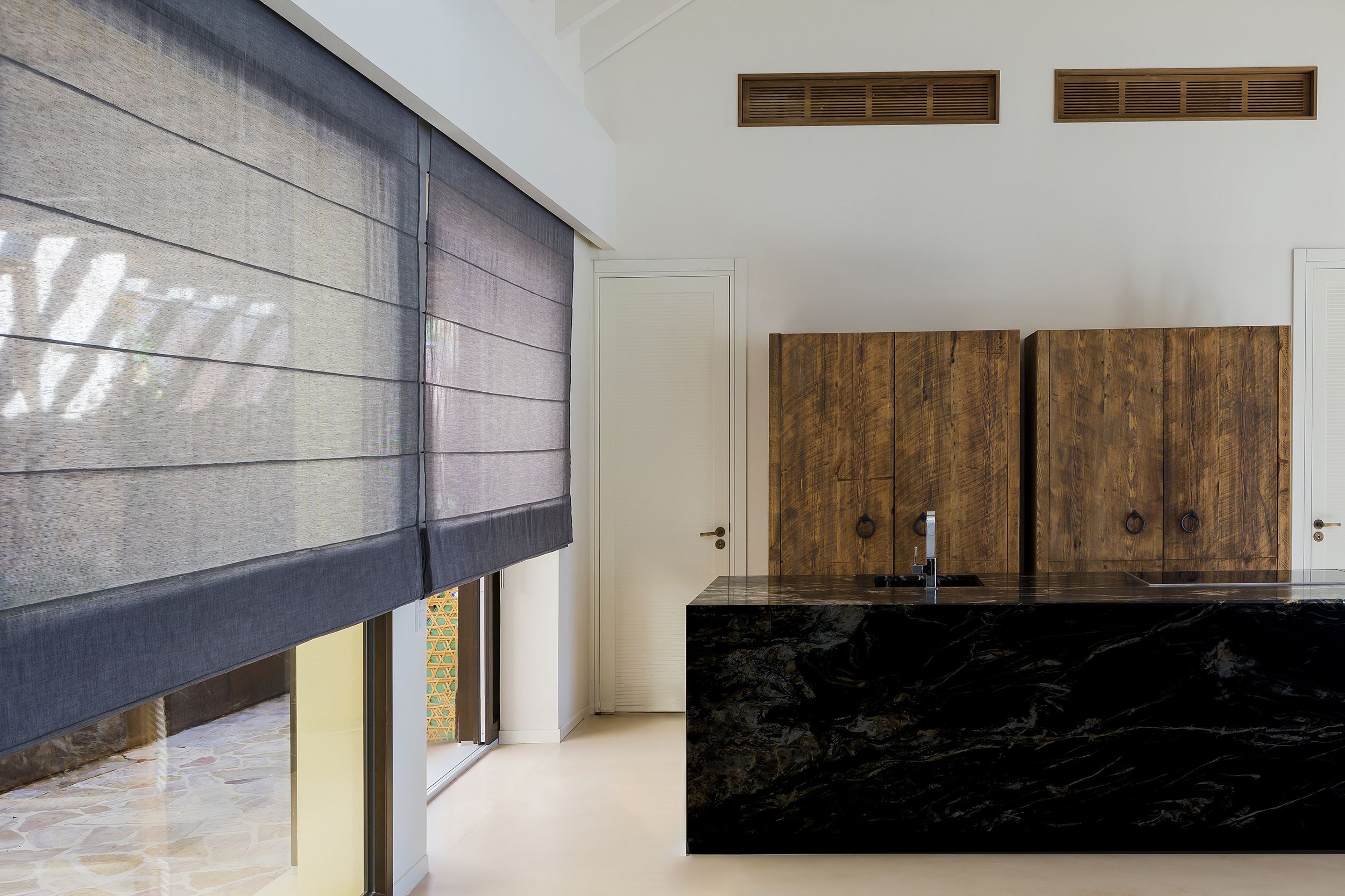 Terracotta Roman blind over a living-room window