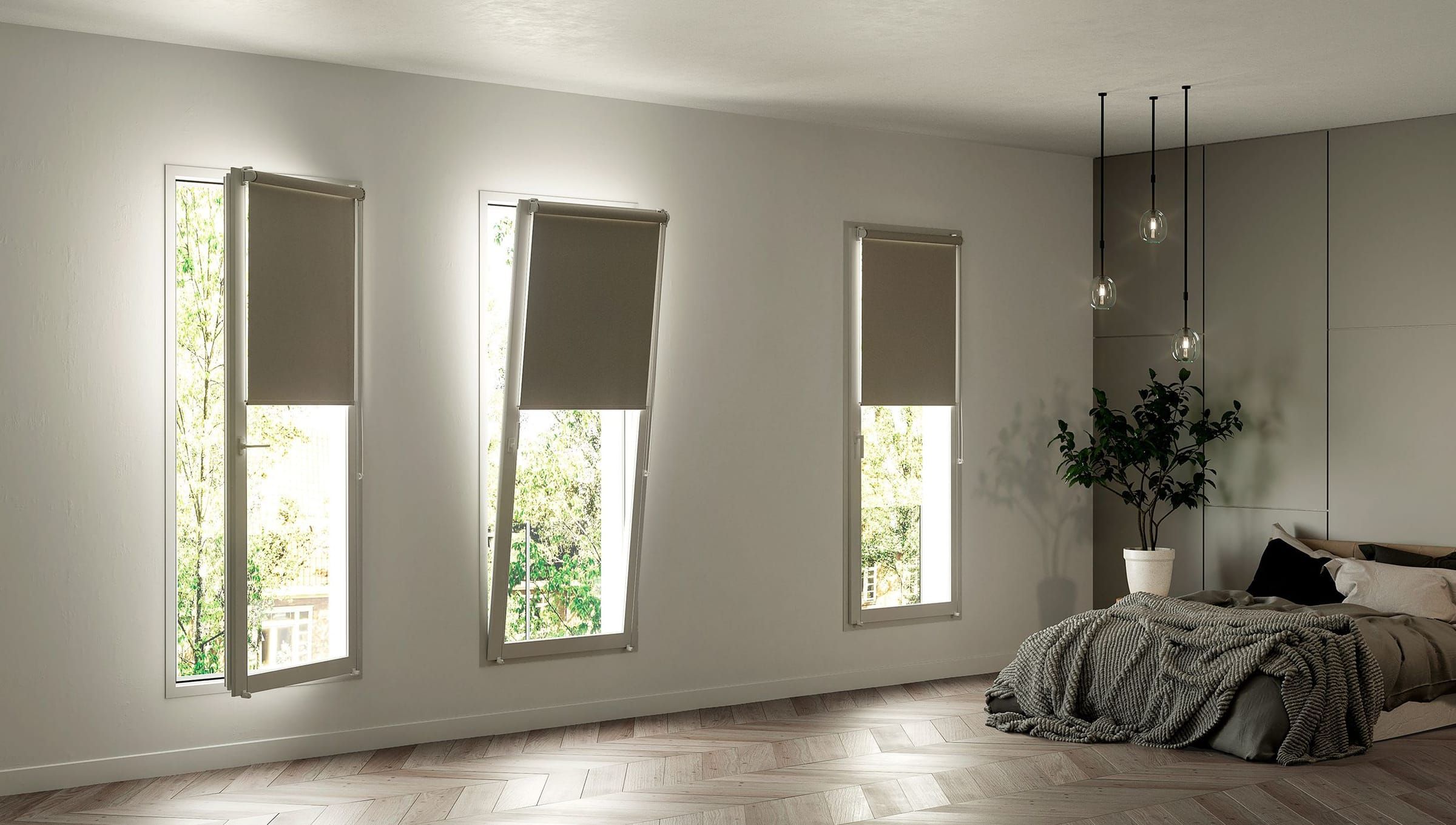 Dormitorio con estores enrollables VEOS colgados en ventanas oscilobatientes abiertas